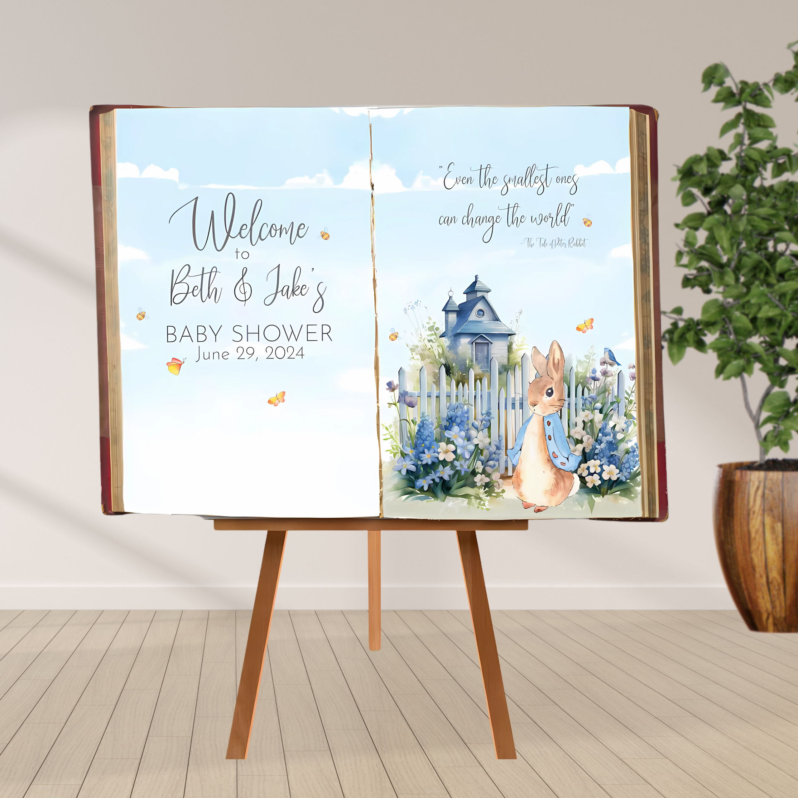 Peter Rabbit Baby Shower Storybook Backdrop – Custom Welcome Sign Peter Rabbit storybook baby shower backdrop with open book design, blue florals, and personalized welcome message.