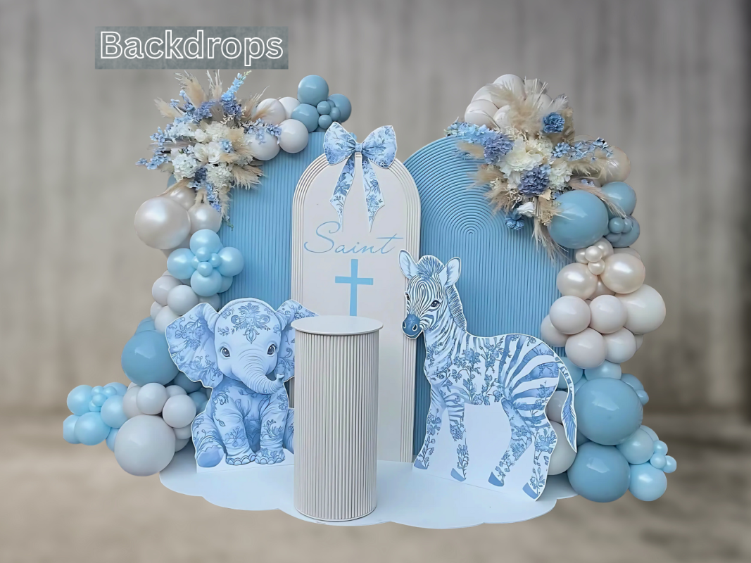 Baby shower setup with custom blue floral elephant and zebra cutouts, balloon garlands, and personalized backdrop.