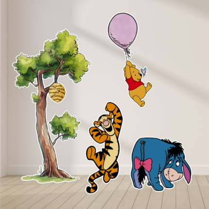 storybook first birthday party setup with character cutouts and decorations