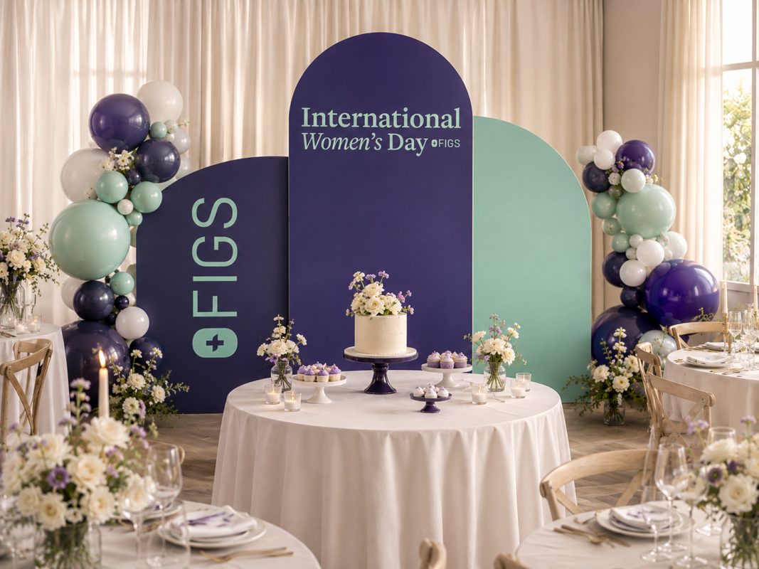 Three-panel International Women’s Day corporate backdrop with custom FIGS branding
