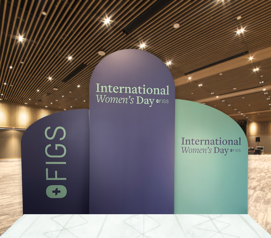 Three-panel International Women’s Day corporate backdrop with custom FIGS branding