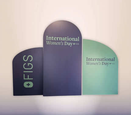 Three-panel International Women’s Day corporate backdrop with custom FIGS branding