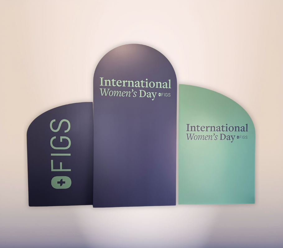 Three-panel International Women’s Day corporate backdrop with custom FIGS branding
