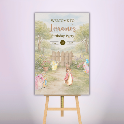 Personalized storybook rabbit birthday welcome sign with custom name, date, garden scene, and watercolor character artwork displayed on an easel