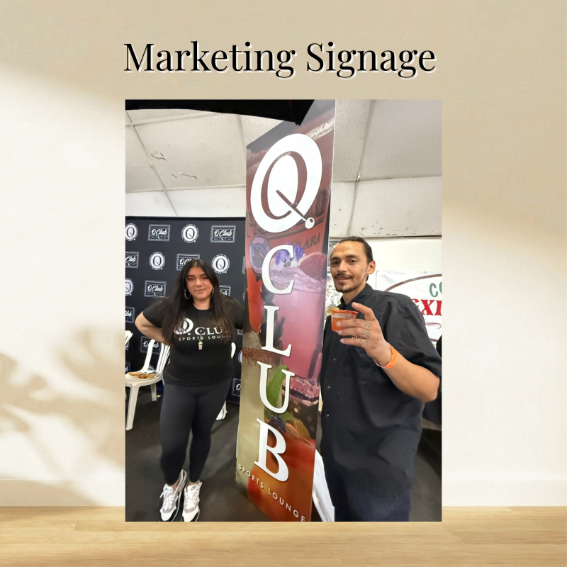 Tall branded sports lounge marketing sign displayed between two event representatives