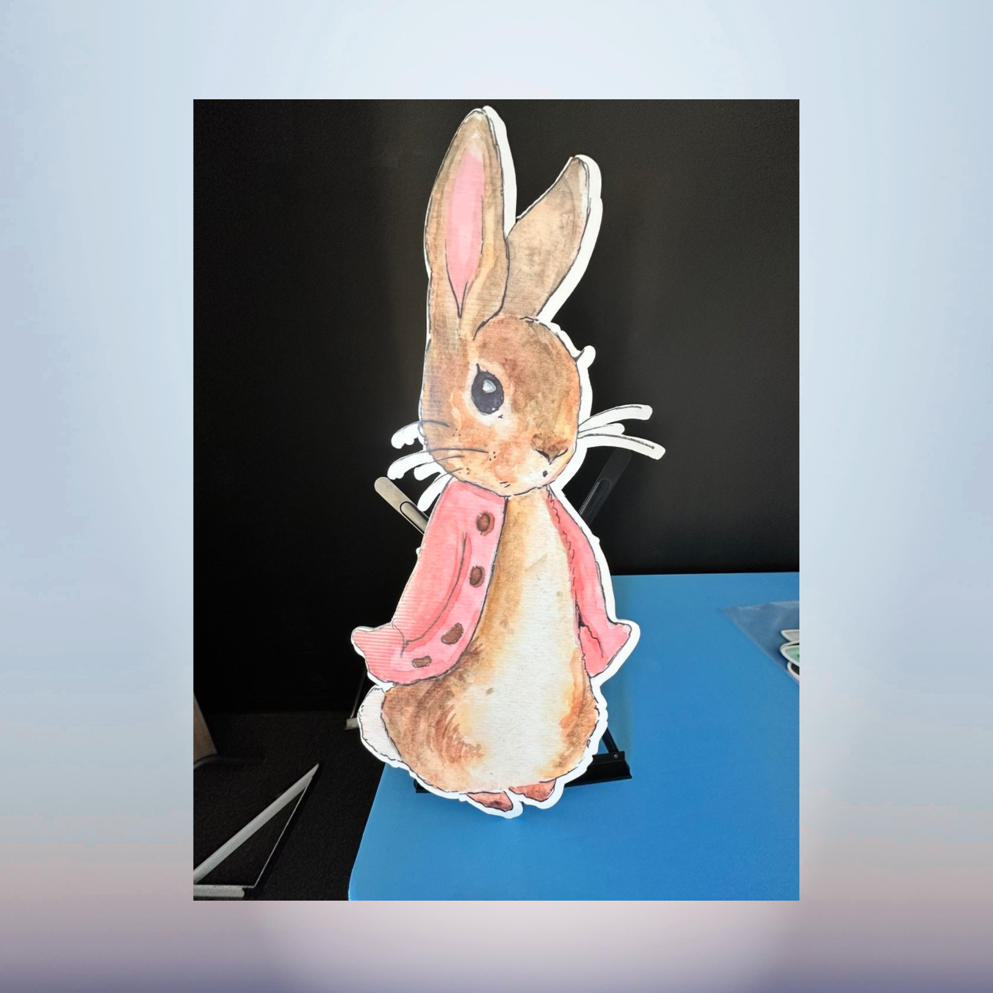 Pink watercolor rabbit character cutout for a Peter Rabbit themed baby shower