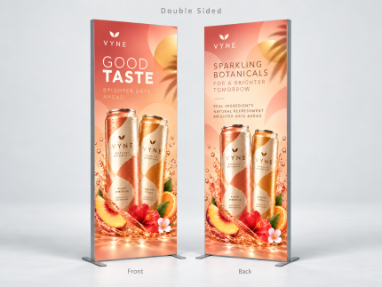 Front and back of a custom double-sided SEG fabric stand with peach-colored beverage branding