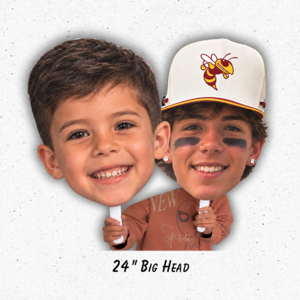 Two handheld big head photo cutouts, including a player wearing an Oxnard Yellowjackets cap, with a 24-inch Big Head label.